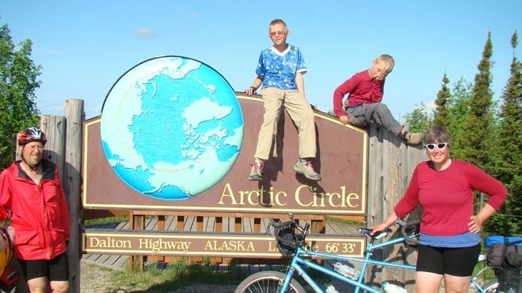 family on bikes at the arctic circle