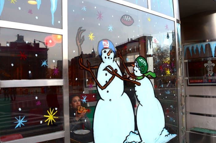 west village pizza joint with snowmen